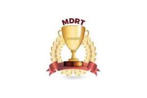 A gold trophy with the word mdrt in it.